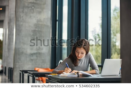 Foto stock: Female College Student In A Library