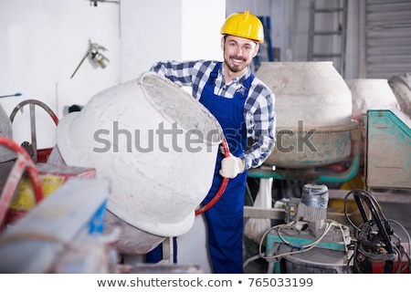 Foto stock: Man With A Cement Mixer