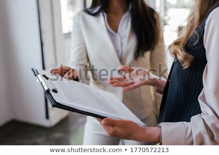 Foto stock: Cropped Image Of Businesswoman Pointing