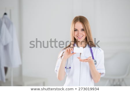 Stock foto: Woman Doctor Showing Clipboard With Copyspace