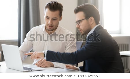 Foto stock: Team Of Two Computer Experts At Workplace