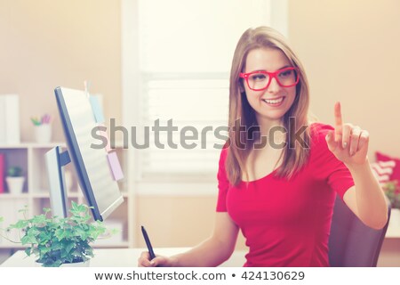 ストックフォト: Beautiful Girl Pointing At Something On The Tablets Screen