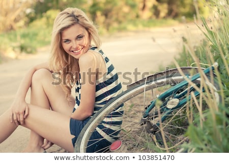 Foto stock: Young Blonde Woman On A Vintage Bicycle