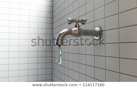 Stock fotó: Chrome Water Tap With The Blue Drop Falling Down