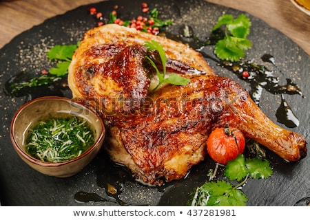 Stock fotó: Grilled Chicken Legs With Vegetables On Cutting Board