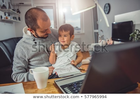 [[stock_photo]]: Cheerful Bearded Man Freelancer Working At Home