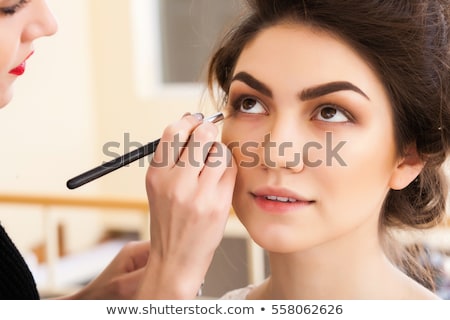 [[stock_photo]]: Professional Make Up Artist Doing Make Up In Beauty Salon