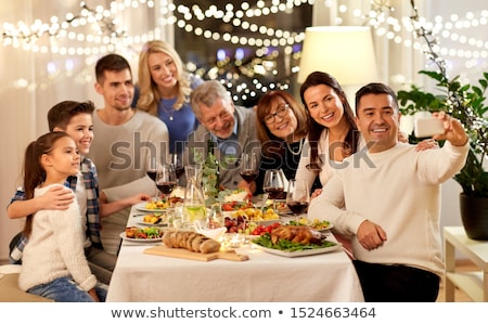 Stockfoto: Family Having Dinner Party And Taking Selfie