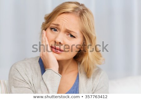 Foto stock: Unhappy Woman Suffering From Toothache At Home