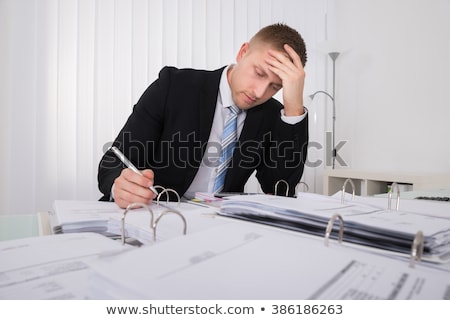 Zdjęcia stock: Stressed Accountant Working Late In Office