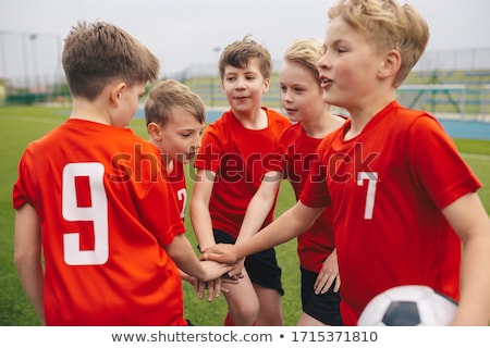 Soccer Team With Junior Coach Gathering Together In A Circle Stockfoto © matimix