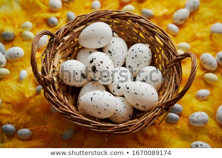 Сток-фото: Easter Holidays Concept White Dotted Chicken Eggs In The Wicker