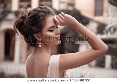 Stock fotó: Pretty Woman With Jewelry And Long Hair