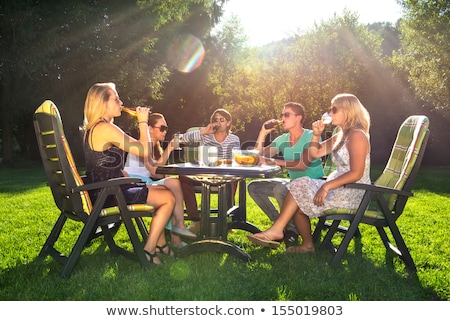 ストックフォト: Friends Enjoying Garden Party On A Sunny Afternoon