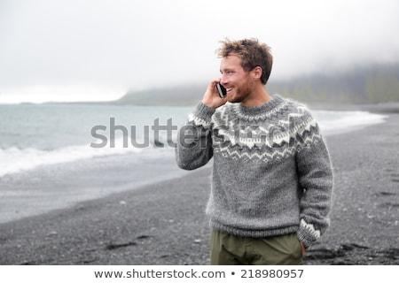 Stock fotó: Handsome Man Walking On Icelandic Black Sand Beach