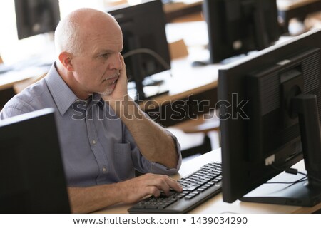 Foto stock: Elderly Businessman Resting Chin On Hand