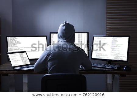 ストックフォト: Hacker Using Multiple Computers For Stealing Data