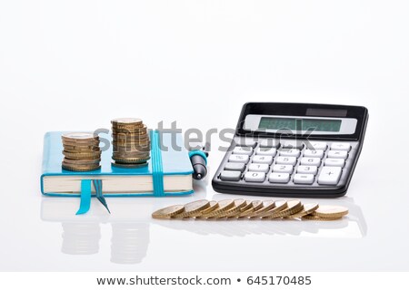 Stockfoto: Stack Of Coins And Calculator