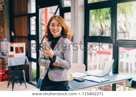 Stockfoto: Happy Asian Woman Student With Tablet Pc At Home