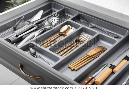 Foto d'archivio: Drawers With Different Kitchenware