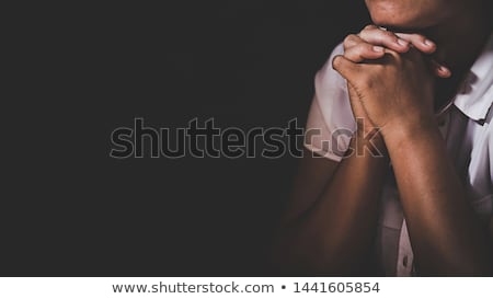 ストックフォト: Praying Hands On A Holy Bible