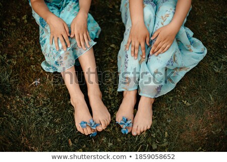 [[stock_photo]]: Beautiful Young Long Legged Girl On Grass In Park