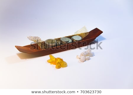 Foto stock: Goldfish And Money