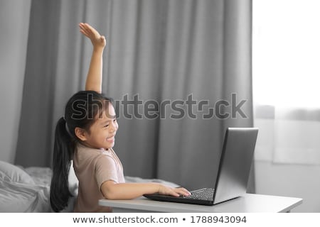 Foto stock: Young Woman Staying With Raised Hands