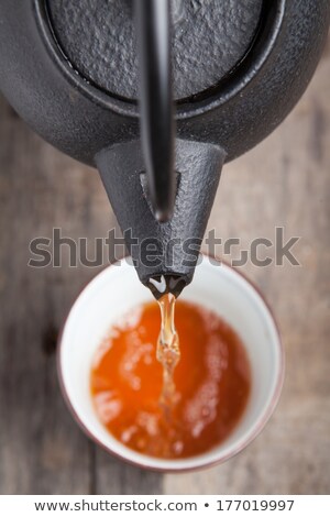 [[stock_photo]]: Green Tea Being Poured Out Of A Japanese Teapot