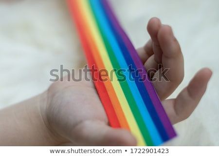 Сток-фото: Hands Holding Rainbow Gay Pride Awareness Ribbon