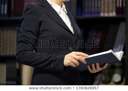 [[stock_photo]]: Lawyer Reading Book In The Law Library