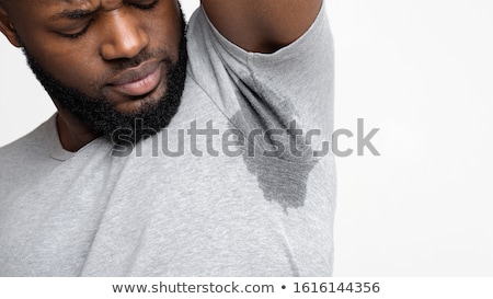 Stock photo: Man With An Sweat Stain In His Underarm