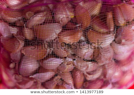 Stockfoto: Whole Garlic Bulbs In String Bag