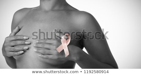 Stockfoto: Shirtless Woman For Breast Cancer Awareness With Ribbon On White Background