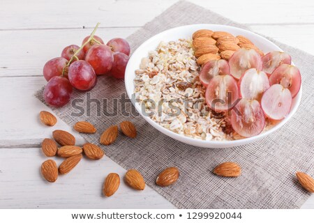 [[stock_photo]]: Slices Of Almond In The Heap On A Pink Background Close Up View
