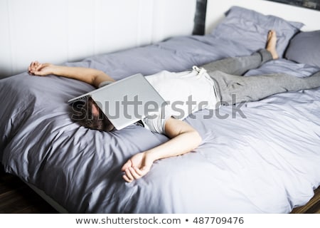 Сток-фото: Man Sleeping Over Laptop Computer In Bed