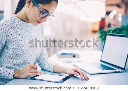 [[stock_photo]]: Woman Signing Into Website On Digital Tablet