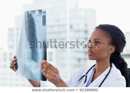 Foto stock: Young Female Doctor Radiologist Sitting At The Clinic