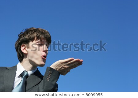 Stock fotó: Businessman With Kisses On His Face In An Empty Space