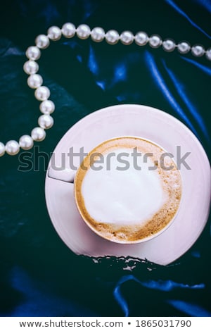 Сток-фото: Cup Of Cappuccino For Breakfast With Satin And Pearls Jewellery