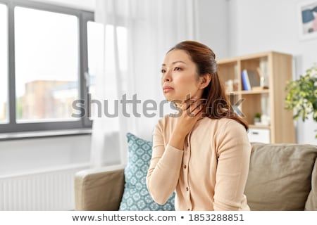 Stock foto: Sick Woman Touching Her Lymph Nodes At Home