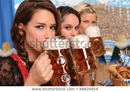 Stockfoto: Pretty Bavarian Girl Drinking Beer