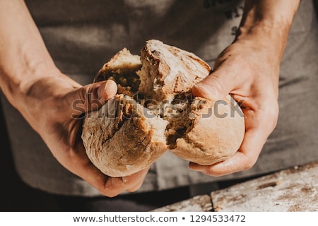 Stock photo: Bakers Hands With A Bread