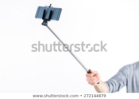 Сток-фото: Casual Man Using A Selfie Stick