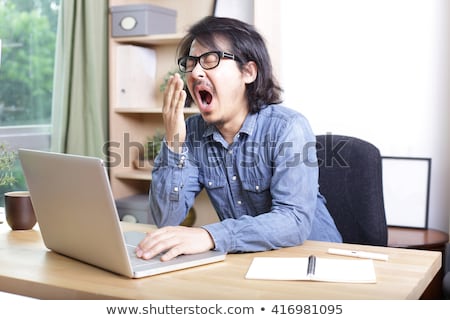 Foto stock: Businessman Sleeping At The Table With Laptop Computer