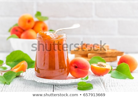 Сток-фото: Apricot Jam And Fresh Fruits With Leaves On White Wooden Table