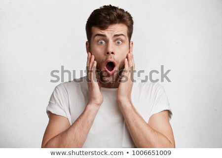 ストックフォト: Caucasian Man Wearing Blue Tshirt And Trendy Hairstyle