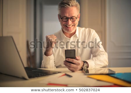 Stock photo: Smartphone In Hands Of Successful Businessman