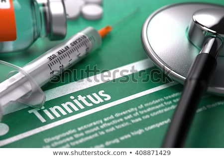 Foto d'archivio: Diagnosis - Tinnitus Medical Concept With Blurred Background