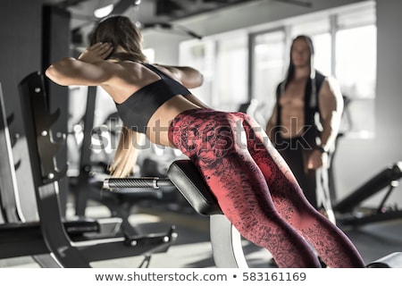 Zdjęcia stock: Sportive Girl Does Exercise In Gym